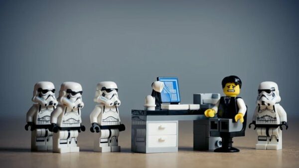 Stormtrooper legos featured around a lego businessman. Source: pixabay.com
