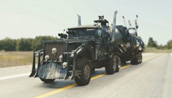 A black truck with skulls on driving down an open road. Source: pixabay.com