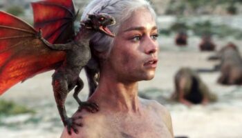 Emilia Clarke as Daenerys Targaryen with baby Drogon