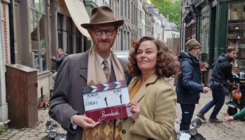 Mark Gatiss & Polly Walker on set, with a clapperboard for the first shot of Bookish