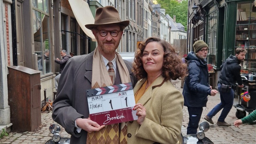 Mark Gatiss & Polly Walker on set, with a clapperboard for the first shot of Bookish