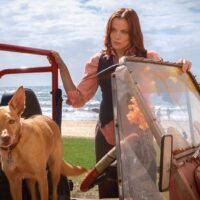 Return to Paradise - Anna Samson as McKenzie Clark with a canine friend