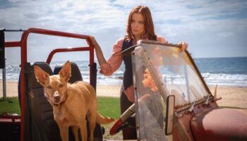 Return to Paradise - Anna Samson as McKenzie Clark with a canine friend