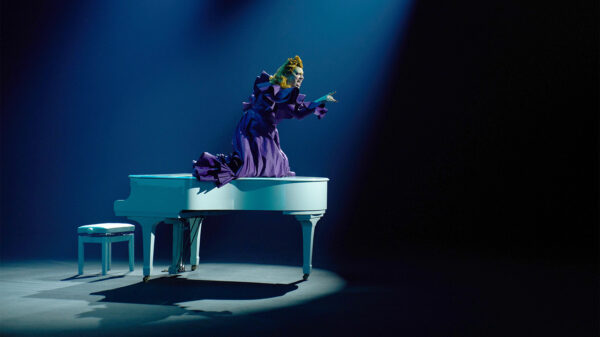 Doctor Who: The Devil's Chord - Maestro in purple atop a grand piano