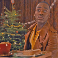 Doctor Who Christmas 2024 - The 15th Doctor (Ncuti Gatwa) bearing a ham and cheese toastie, and a pumpkin spiced latte