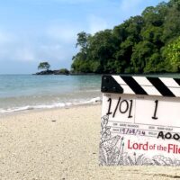 The Lord of the Flies clapperboard on an tropical beach.