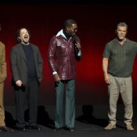 Director Edgar Wright stands on stage with his cast