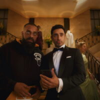 Bait First look image with Guz Khan on the left in a casual outfit and Riz Ahmed on the right in a tuxedo