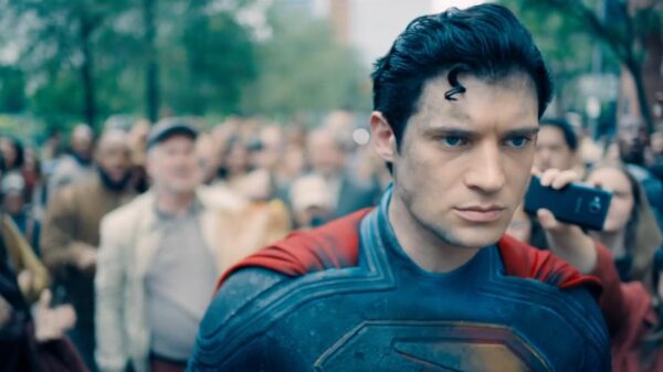 Superman stood in a crowd, ahead of the sequel Superman: Man of Tomorrow