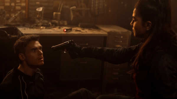 A woman points a gun at a man in a scene from Citadel season 2