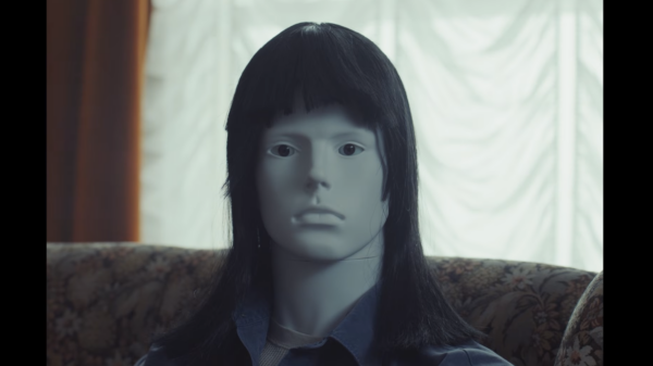 A mannequin with a wig on it, a still form the trailer of Still life
