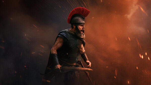 A warrior yelling, surrounded by flames and ash - a screenshot from the new trailer for The Odyssey.