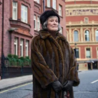 Glenn Close, dressed in furs in her character for Up To No Good