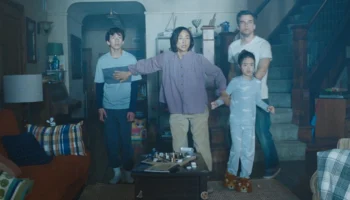A family huddles against a mysterious light in their living room in The Last House