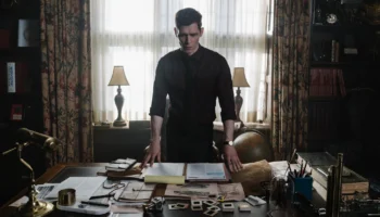 Joseph Morgan stood at a Victorian desk in Herbert West: Reanimator