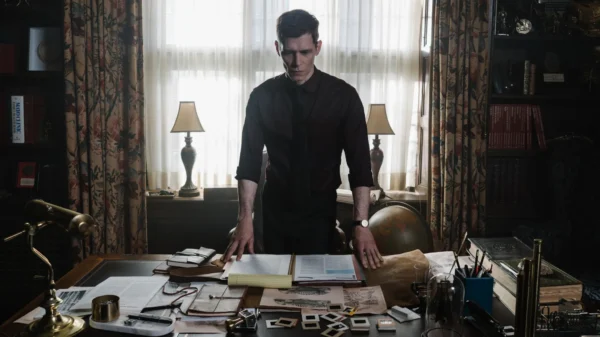 Joseph Morgan stood at a Victorian desk in Herbert West: Reanimator