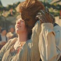 Olivia Colman dancing with her wicker husband