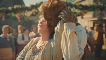 Olivia Colman dancing with her wicker husband