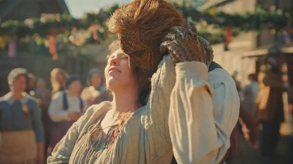 Olivia Colman dancing with her wicker husband