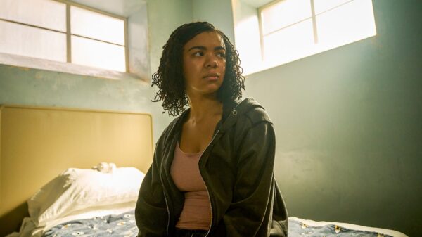 A woman on a bed in a still from The Rapture