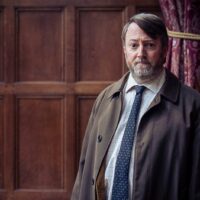 David Mitchell as Ludwig promising more murder and mystery