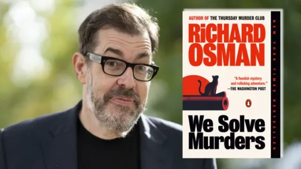 Richard Osman next to his We Solve Murders book